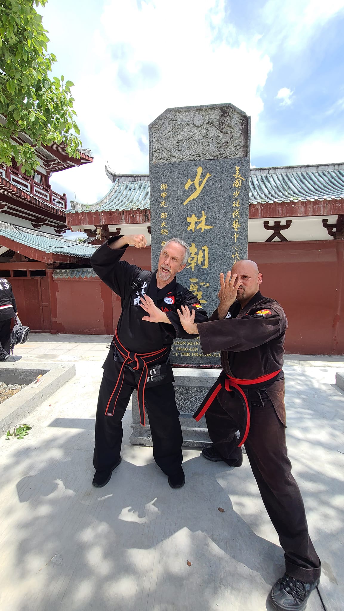 Senior Elder Master David and Elder Master Emir Lau Shifu fooling around in front of our Tablet at the Southern Shaolin temple China